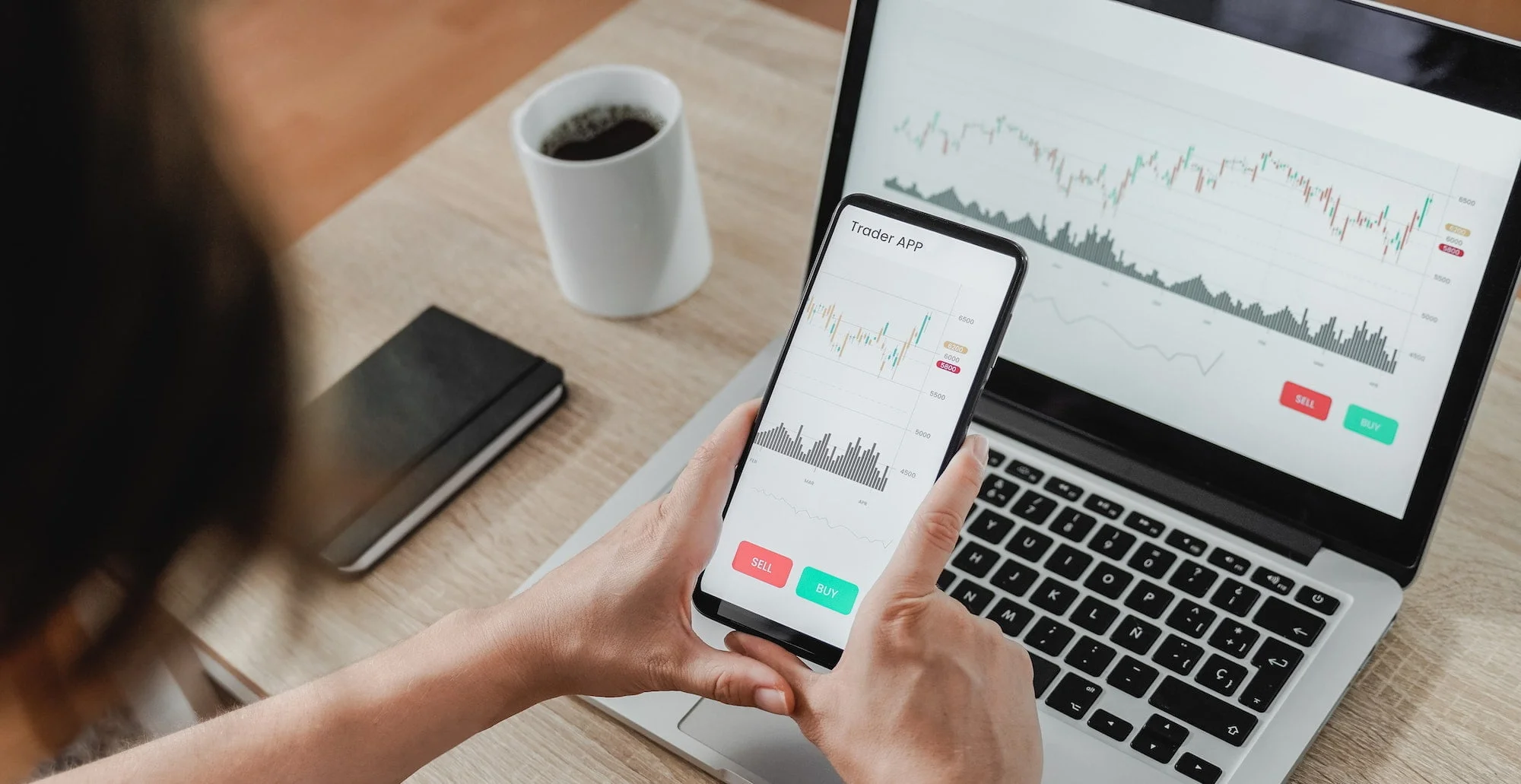 Forex trader using crypto exchange mobile phone app for stock market analysis at hedge fund office